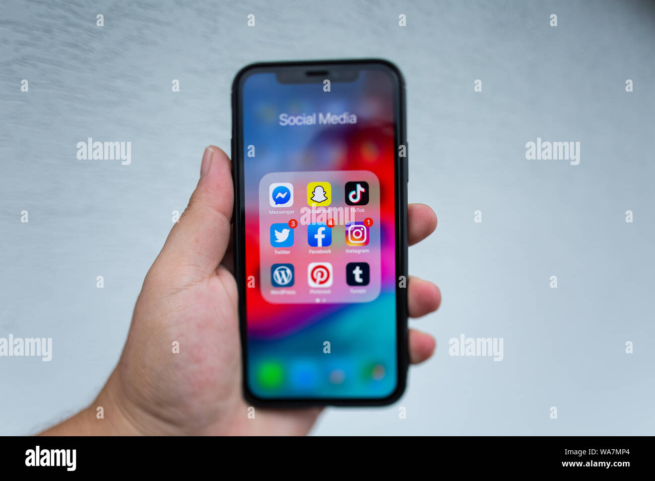 Close Up of Apple iPhone XS Holding in Hand with Social Media Instagram,  Facebook, Pinterest application icons with Notification Stock Photo - Alamy
