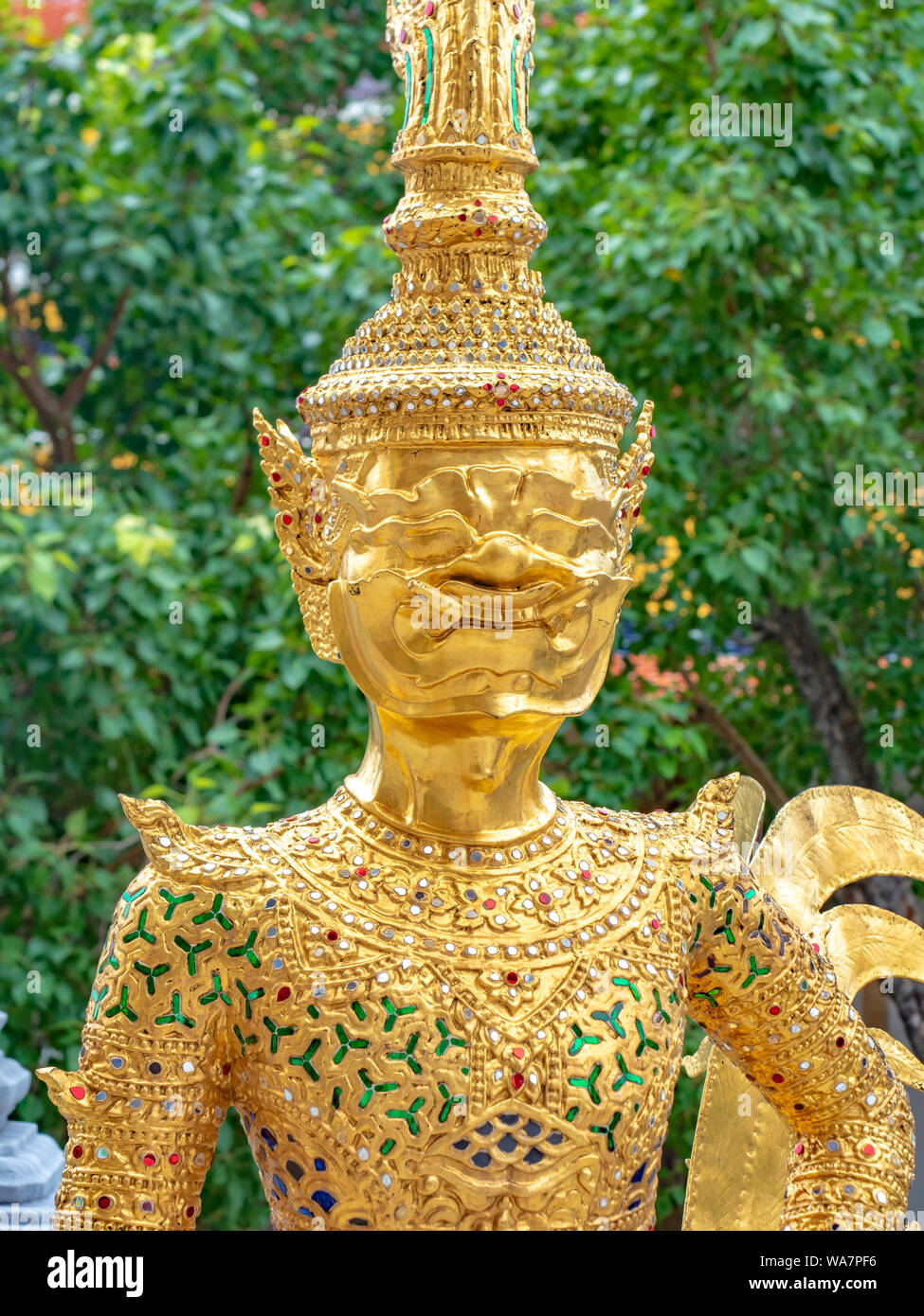 Colourful and Golden sculpture and statues of Temple of Emerald Buddha, Wat Phra Kaew, Grand Royal Palace in Bangkok, Thailand. Stock Photo