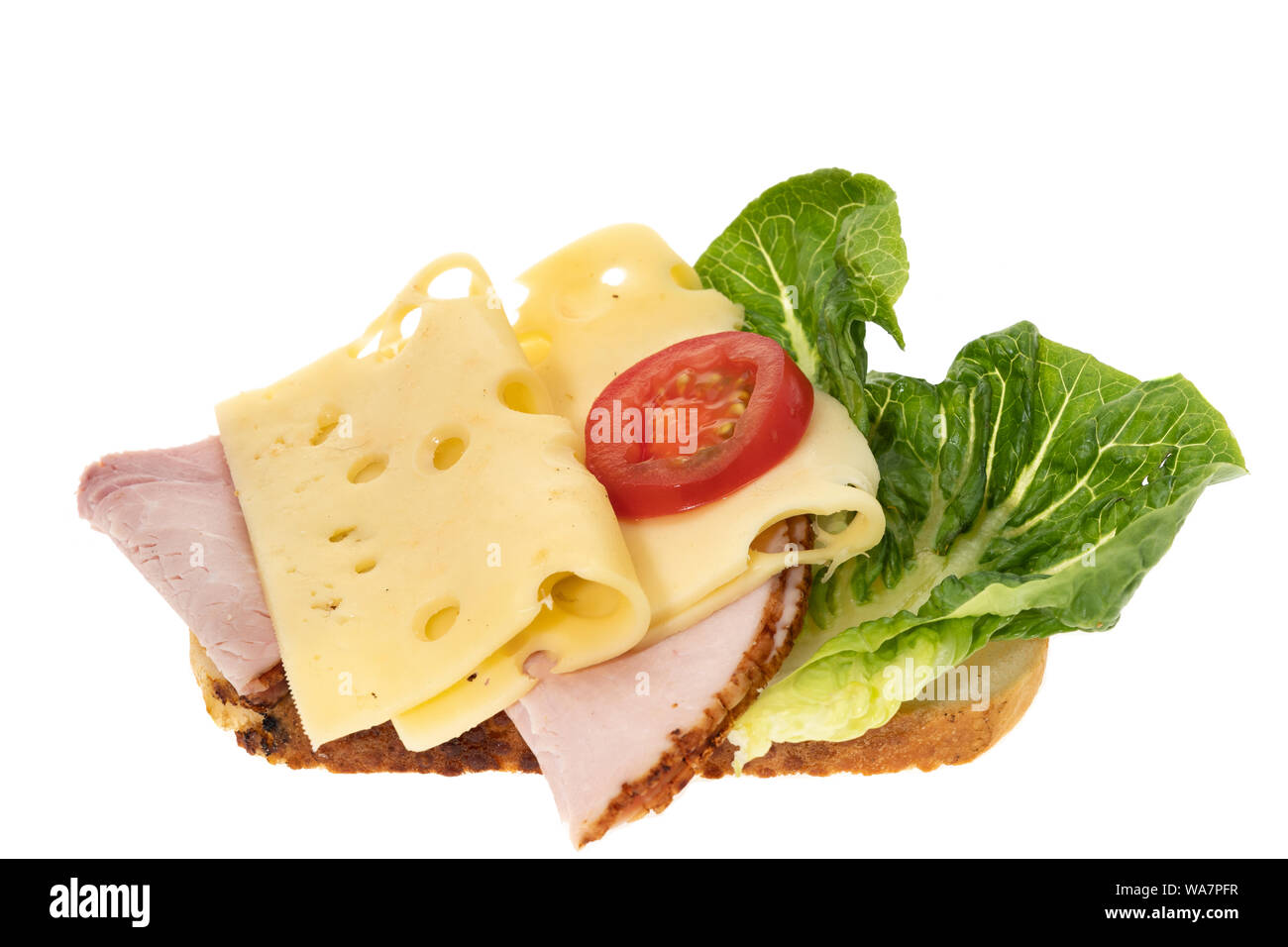 An open ham and cheese sandwich - white background Stock Photo