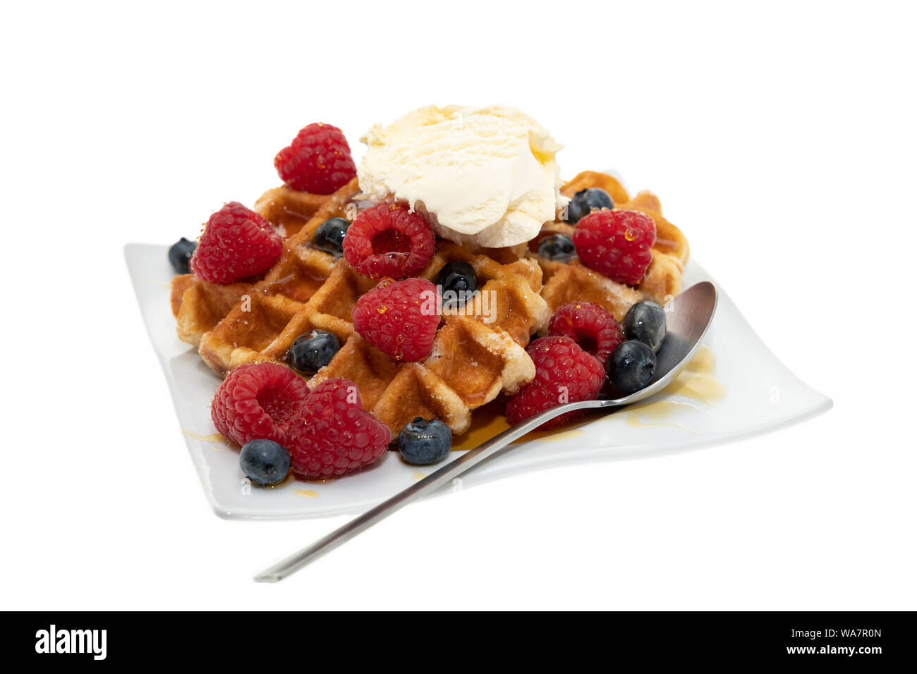 Two Belgian waffles with vanilla ice cream and berries - white ...