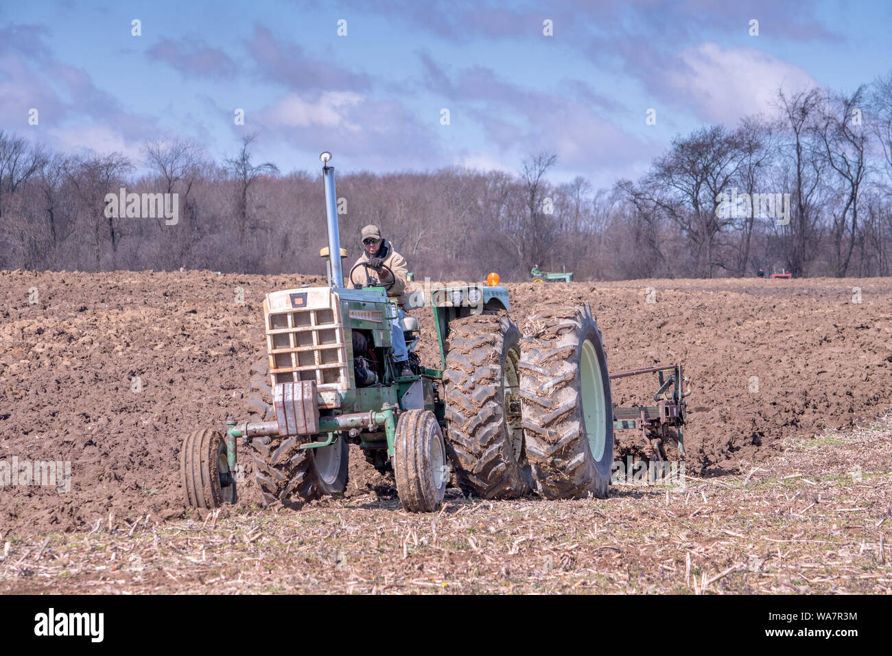 April 28 2018 Buchanan MI USA; A farmer on his tractor plows a field