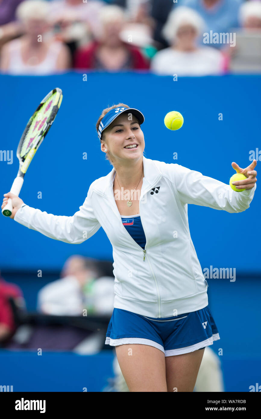 Belinda Bencic of Switzerland hitting tennis ball into crowd after ...