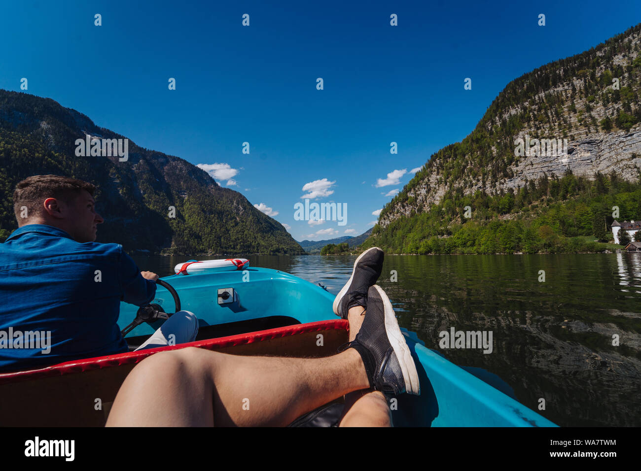 Man driving boat handsome hi-res stock photography and images - Alamy