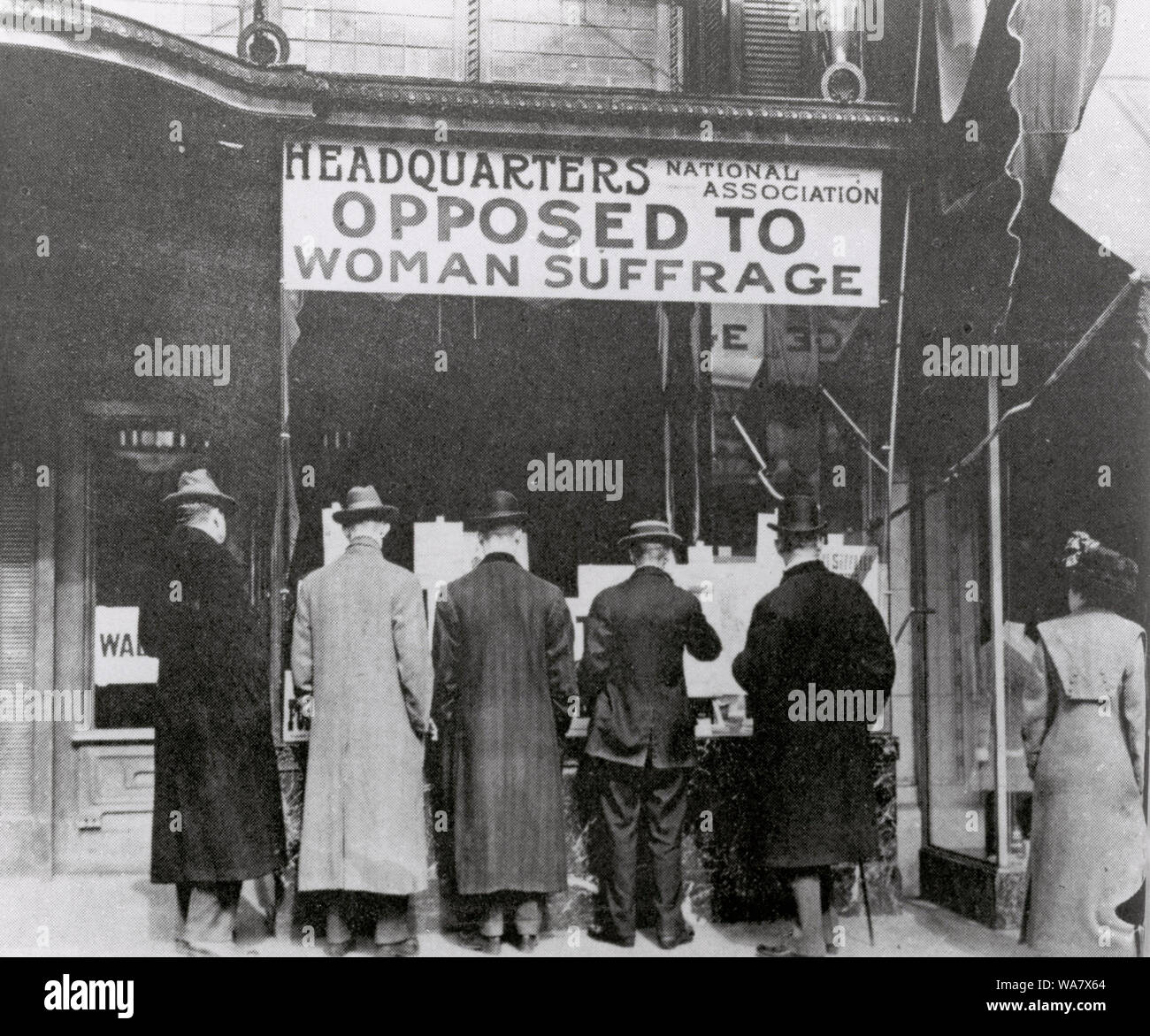 Passers-By Looking at Window Display at the Headquarters of National Association Opposed to Woman Suffrage. 1919 Stock Photo