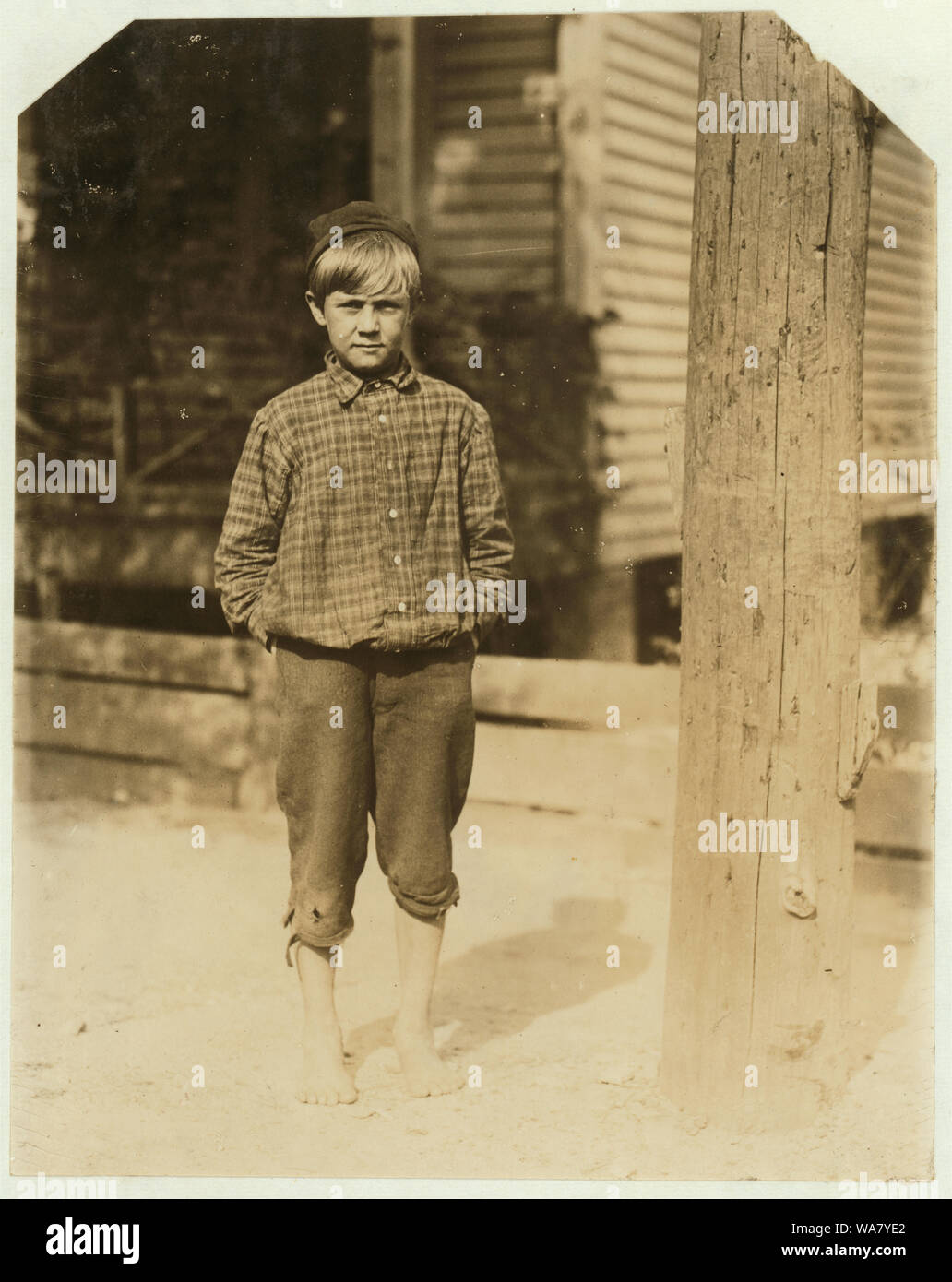 Bruce Tillery, 10 years old. Swept in Eagle Mill, Columbus, Ga. last summer and going to work again next week. Been toting 13 dinners a day. Mother gets most of the money. Several brothers in the mill. 155 2nd Ave. Girard, Ala. Abstract: Photographs from the records of the National Child Labor Committee (U.S.) Stock Photo