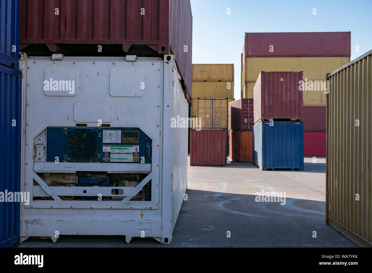 Cargo containers for export and import in maritime terminal. Stock Photo