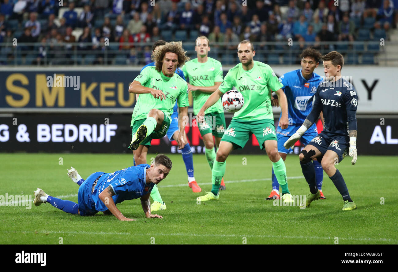 GENT, BELGIUM - AUGUST 18: Mikael Lustig of Kaa Gent battles for the ball with Wout Faes of Kv Oostende and William Dutoit of Kv Oostende during the Jupiler Pro League match day 4 between KAA Gent and KV Oostende on August 18, 2019 in Ghent, Belgium. (Pho Stock Photo