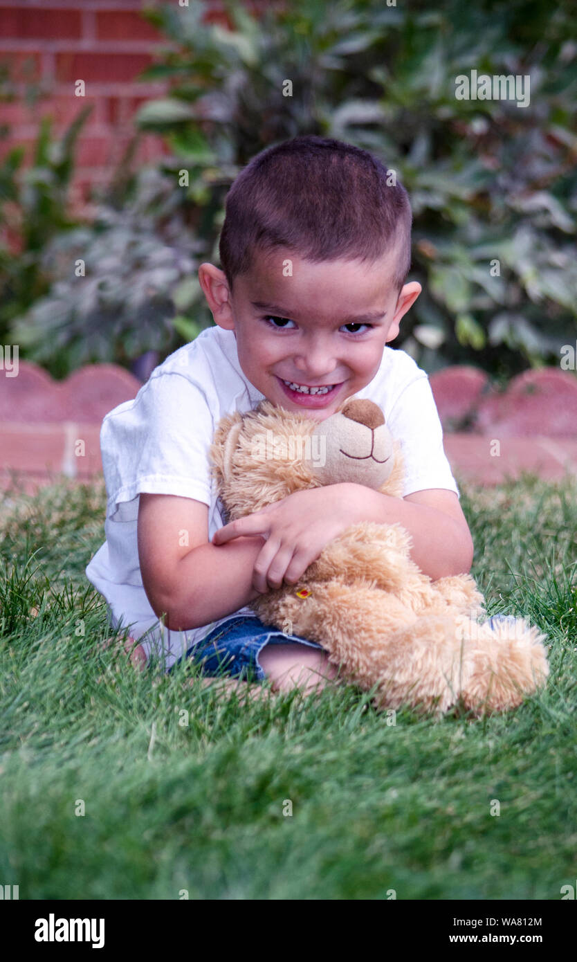 little boy hugging his favorite teddy bear Stock Photo - Alamy