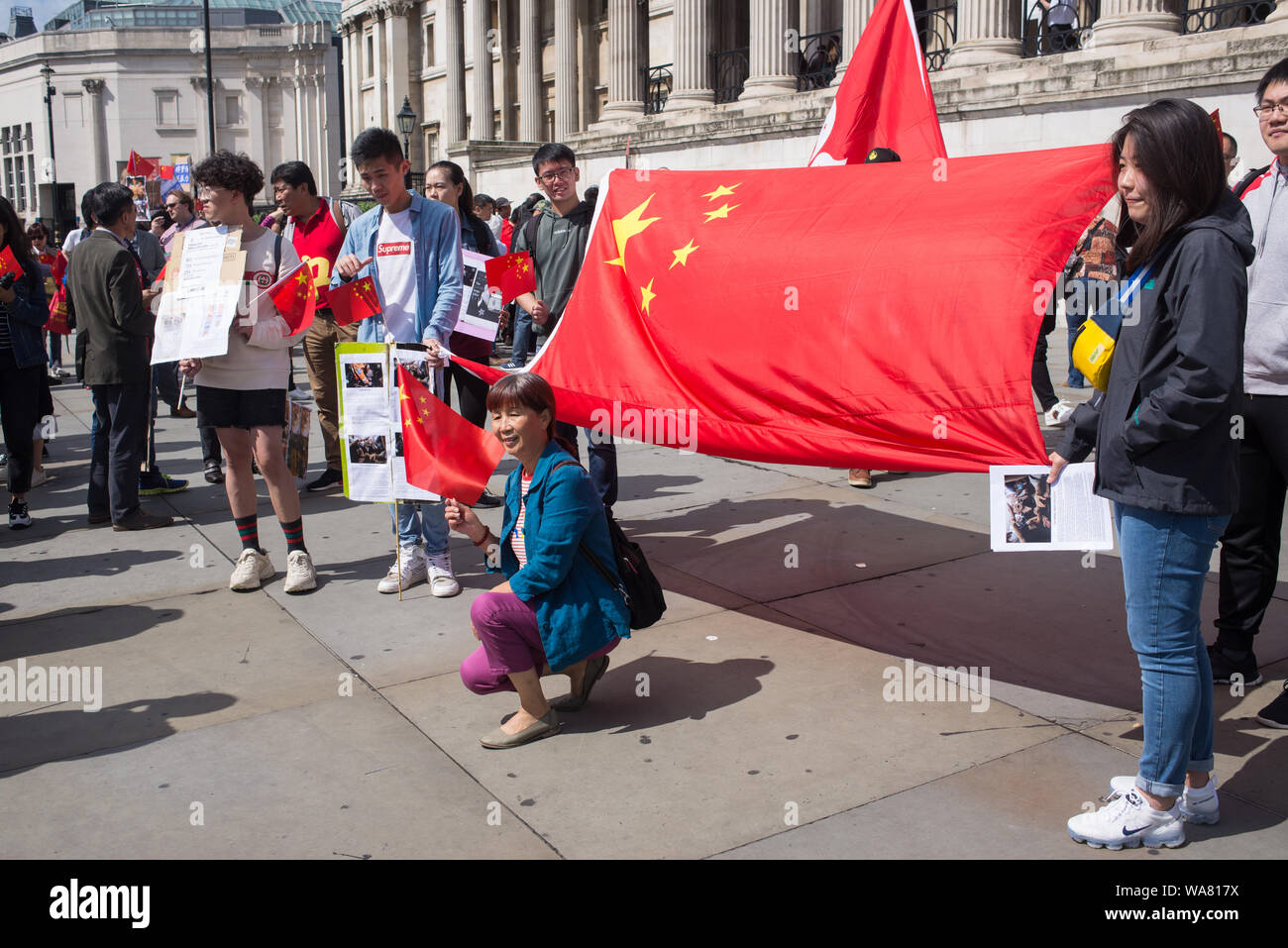 Pro-China protesters and Beijing supporters set up a protest in Trafalgar Square in central London, supporting police and condemning violence over the ongoing protests in Hong Kong. Stock Photo