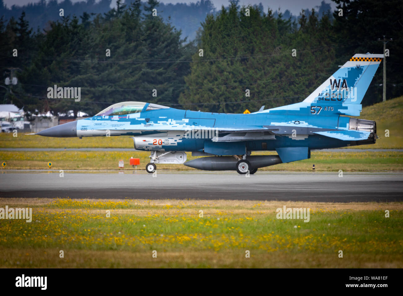 ABBOTSFORD, BC - AUGUST 12 2019 - A F-16 Aggressor taxis runway before departing for home after spending the weekend at Abbotsford Airshow Stock Photo