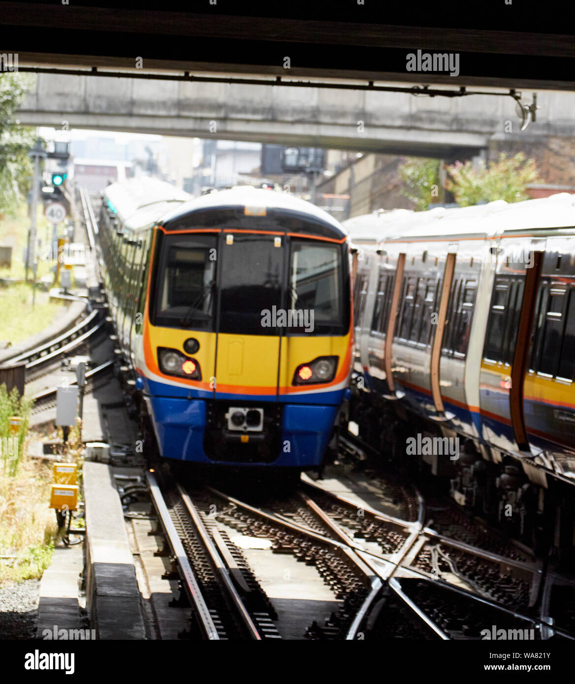 Train and tracks coming into North London station, England, United Kingdom, Europe Stock Photo