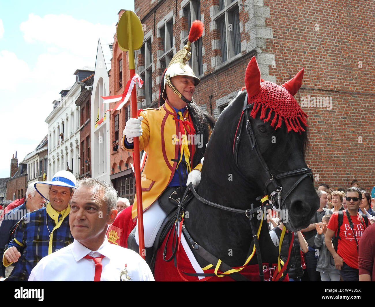 Mons, Belgium. 16 June, 2019. Participant of Ducasse and Lumeçon Game playing role of Saint George on his way to the Grand Place, place of the fight against the Dragon Stock Photo