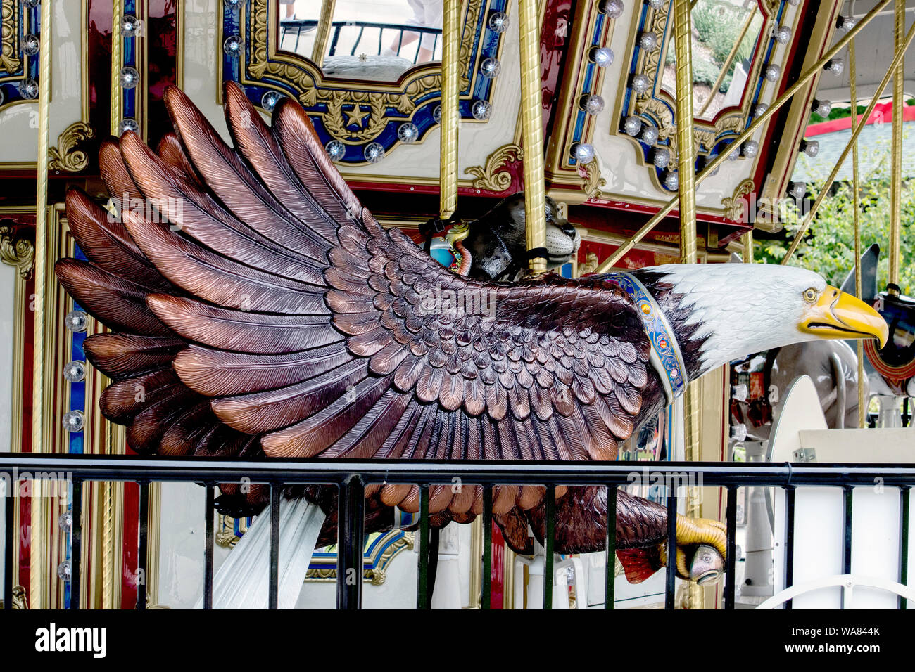 carved eagle statue on an elaborate children's carousal Stock Photo