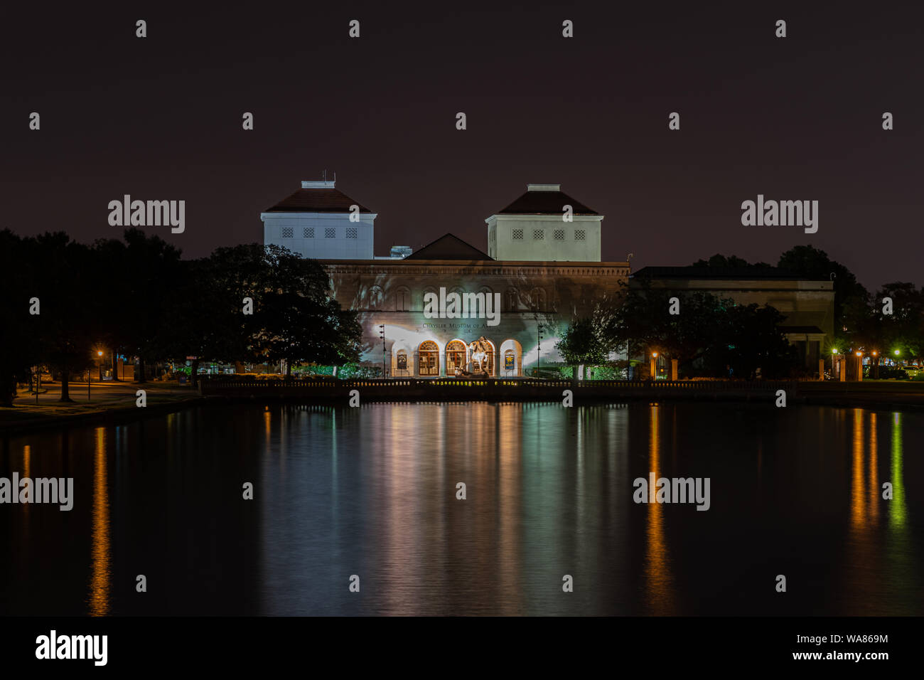 The Chrysler Museum of Art in Norfolk Virginia at night, lights reflecting in the water Stock Photo