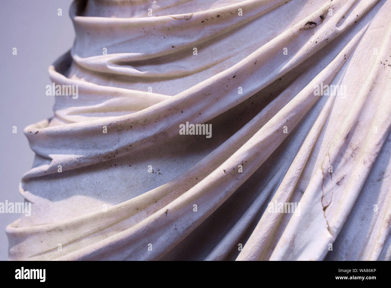 Classic statue sculpted with wetdrapery tecnique. Clothes appears in