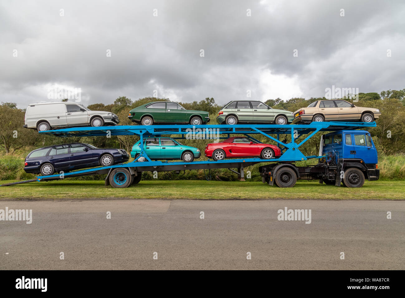 A selection of cars from the 1970's and 1980's on a Leyland 300 car transporter lorry. This vehicle is on display at the Scottish Vintage Bus Museum Stock Photo