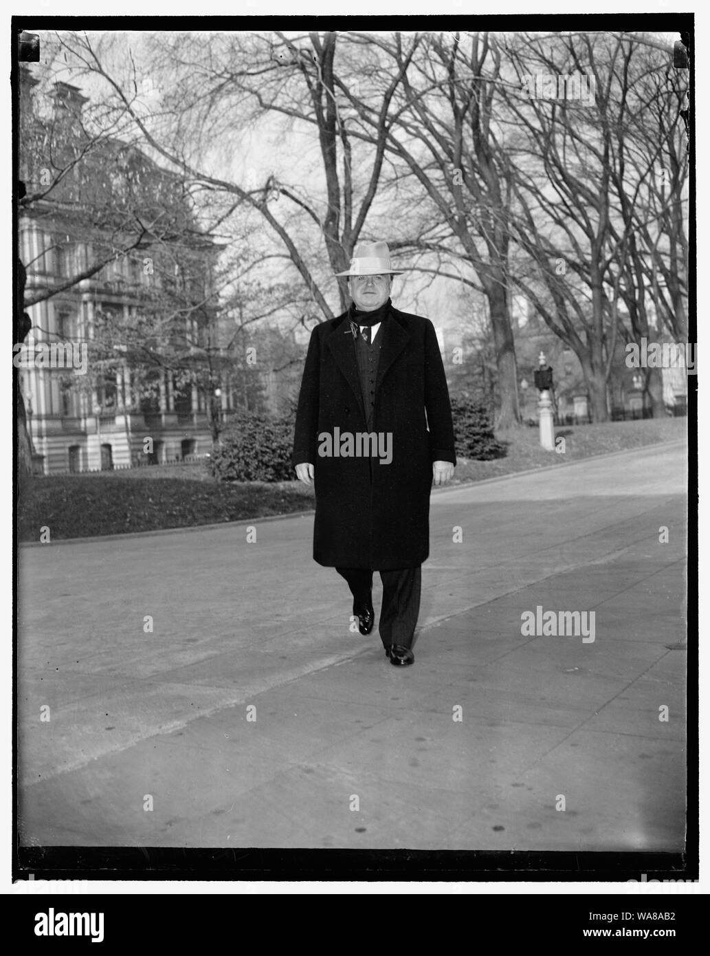 CIO Head calls on president. Washington, D.C., Dec. 19. CIO President John L. Lewis arriving at the White House today where he conferred for 20 minutes with President Roosevelt, he refused to discuss with reporters the nature of his visit but did say, however, that he as there at the president's invitation Stock Photo
