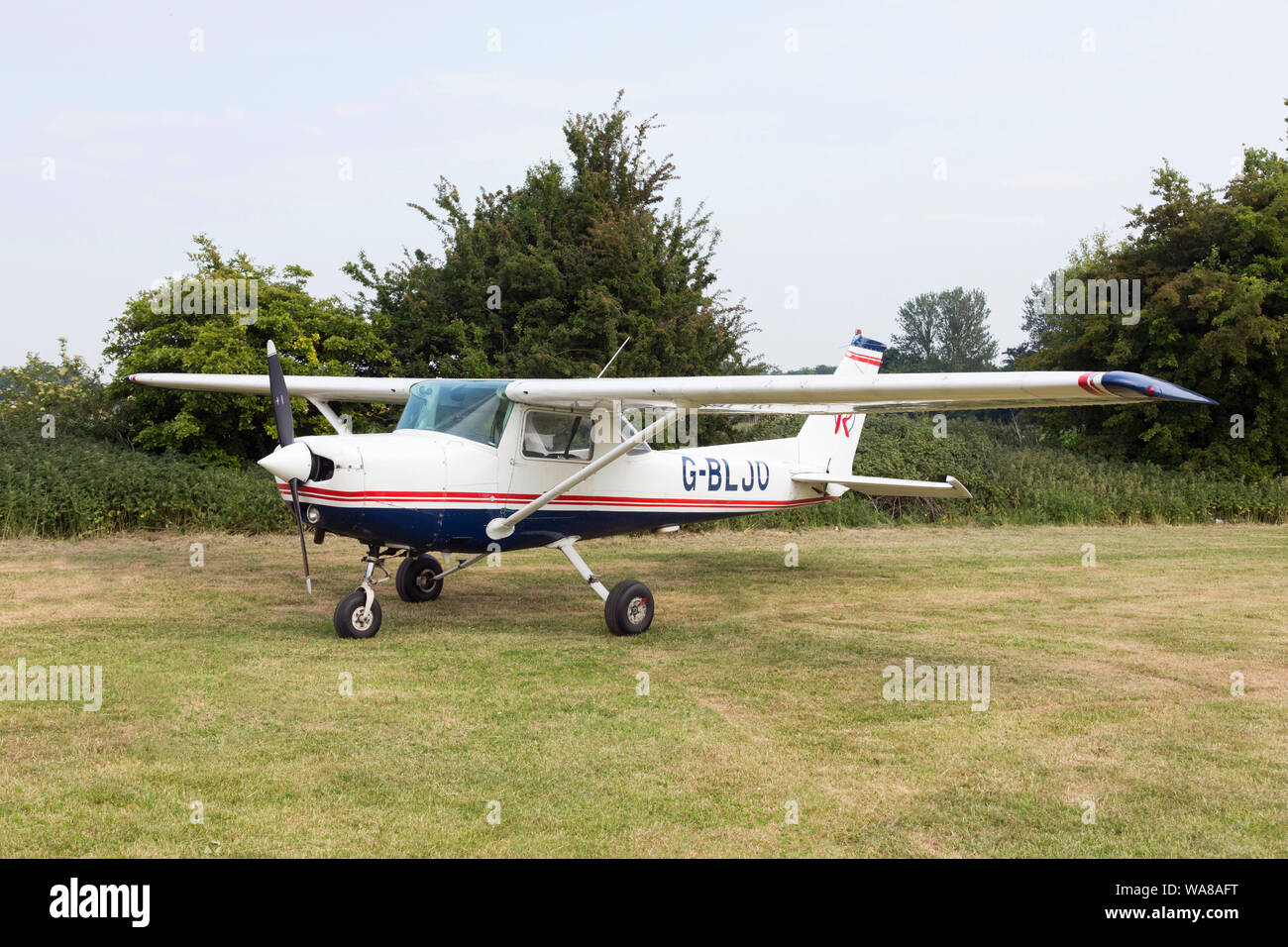 Cessna 152 aircraft parked on grass Stock Photo