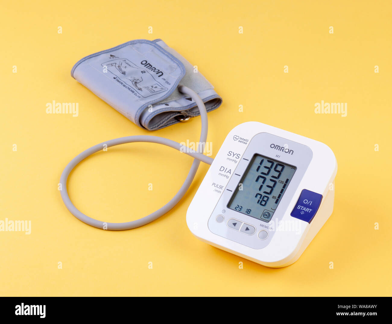 a person having a free checkup using an OMRON hand held body fat monitor  Stock Photo - Alamy