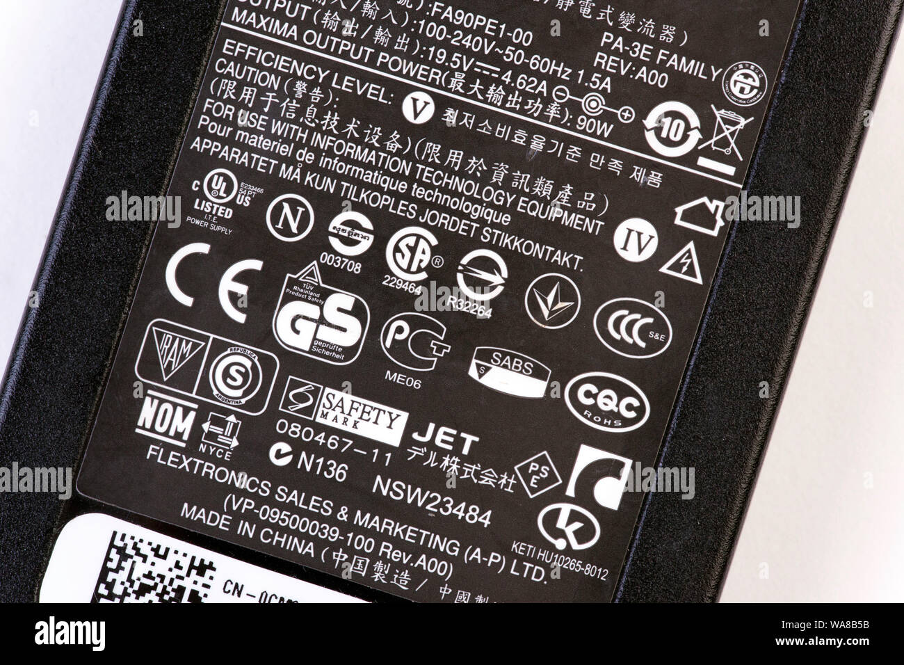 electrical safety standards logos on laptop mains power adaptor Stock Photo