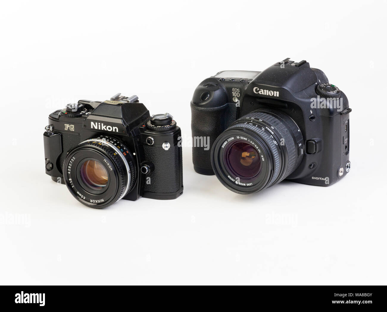 Nikon FG SLR film camera with Canon 10D digital SLR camera Stock Photo