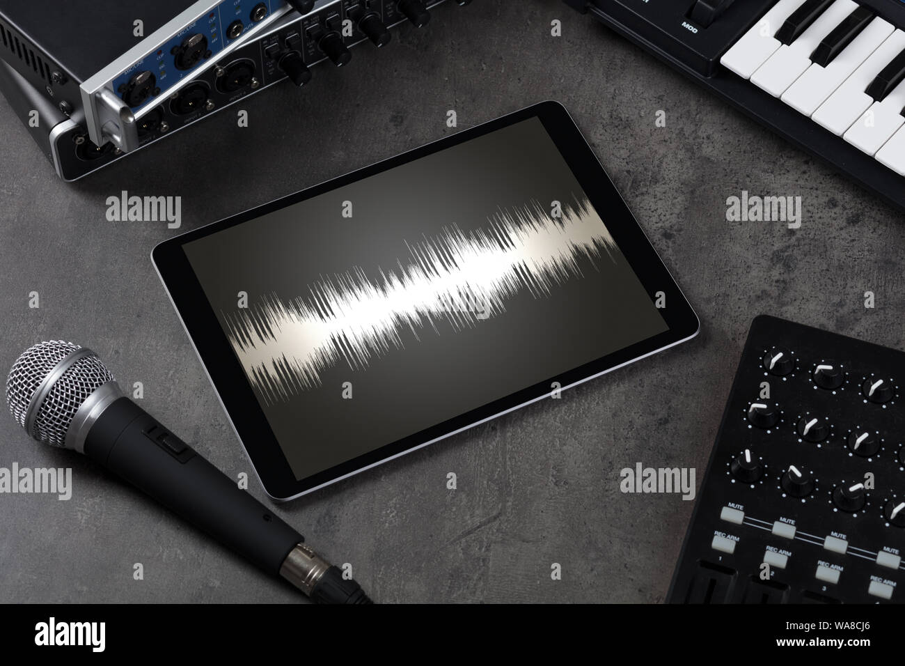 Recording music with tablet and electronic music instruments Stock