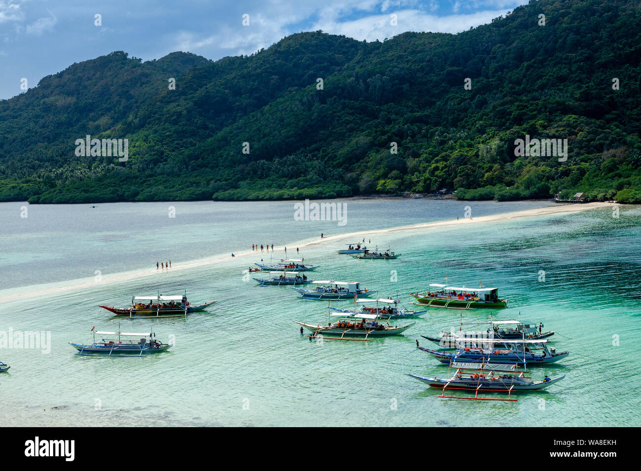 Traditional Wooden Banca Boats Moored At Snake Island, El Nido, Palawan, The Philippines Stock Photo