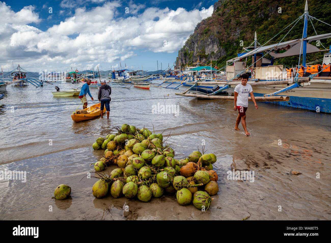 A Pile Of Buko (Fresh Coconuts) On Corong Corong Beach, El Nido, Palawan, The Philippines Stock Photo