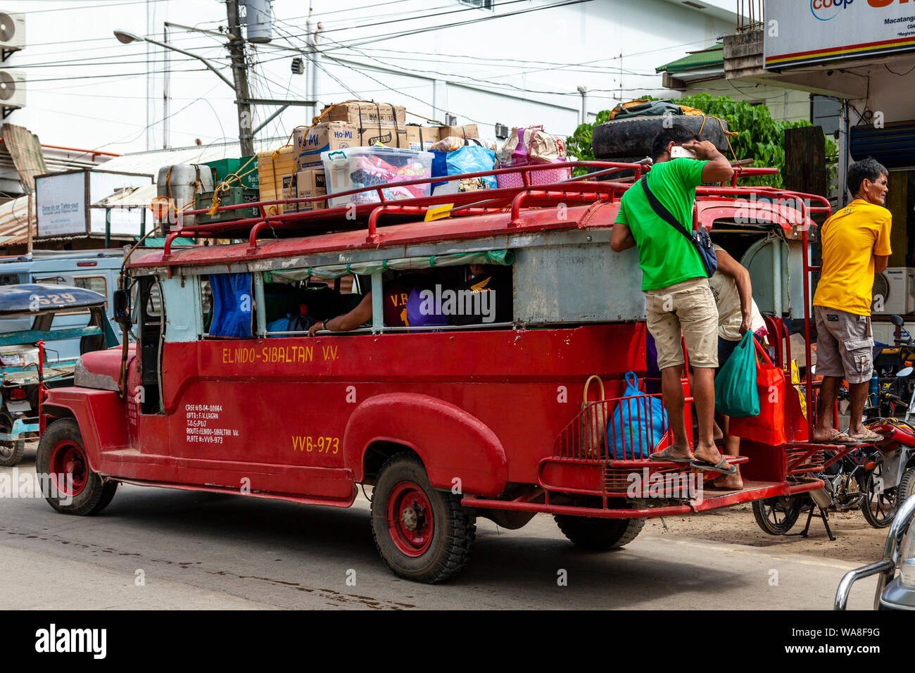 A Jeepney Stops To Let Off Passengers, El Nido, Palawan Island, The Philippines Stock Photo
