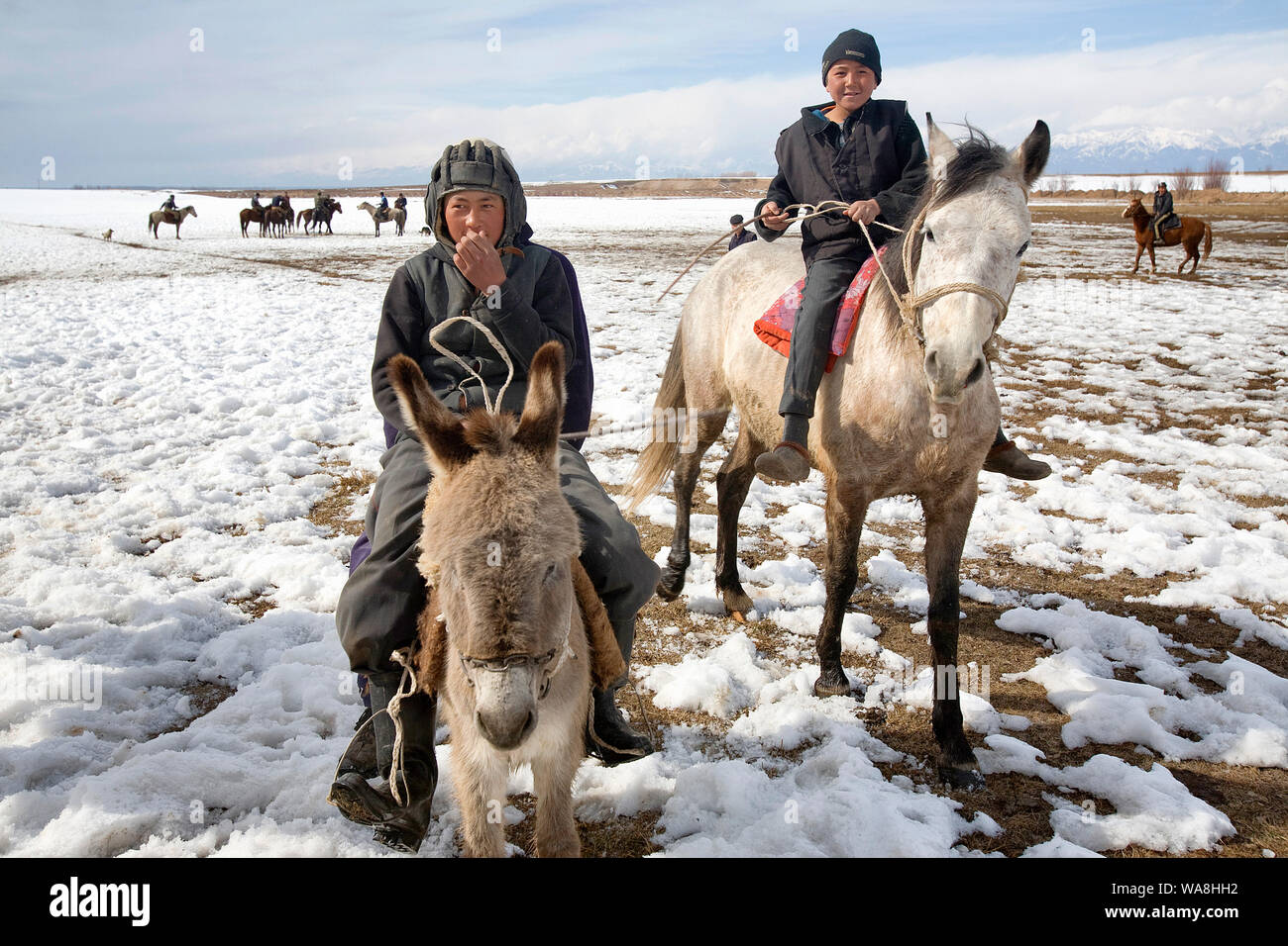 Kyrgyz Republic Travel Images - Kids training in Karakol snow fields for Ulak Tartish, Kuk Pari, Kšk BerŸ, Ulak Tyrtysh, Kok Boru. National game in Ky Stock Photo