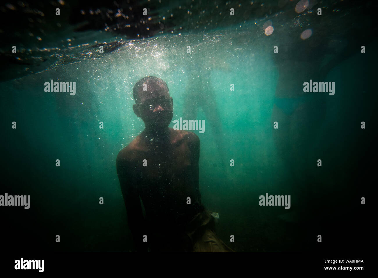A young dominican dives in Najayo Beach, near San Cristobal.    Images for editorial, news usages and creative industry. Spanish born photographer bas Stock Photo