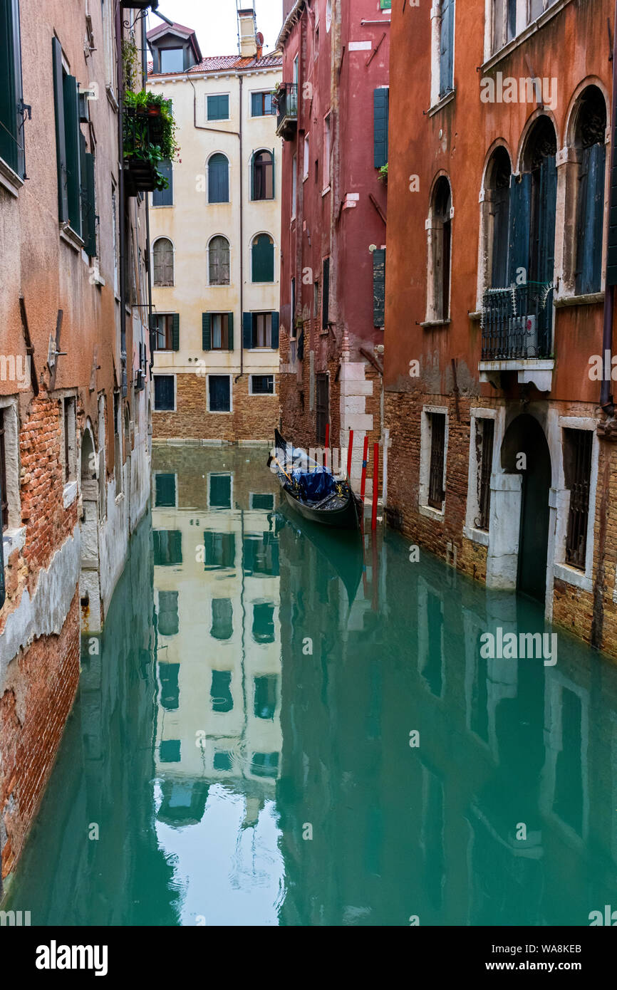 Gondola moored on a side canal, exact location unknown, Venice, Italy Stock Photo