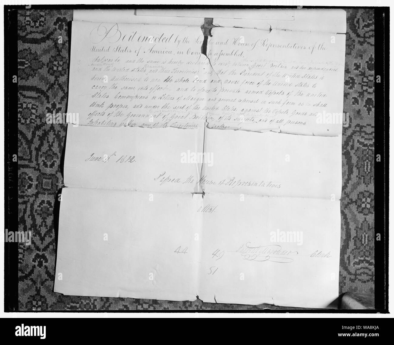 Capitol 'attic' yields records of early American Congresses. Washington, D.C., Jan. 23. Historical records dating back to early American Congresses have just been found during a house-cleaning of the attics and basement of the house wing at the Capitol. 1. Above is the original House Bill written in longhand, which declared that a state of war existed between the United States and Great Britain and dependencies. Signed by Patrick Magruder, then Clerk of the House, the Bill was delivered to the Senate and returned in the form of a 'Confidential Bill' in which a change was made to read 'the Unit Stock Photo