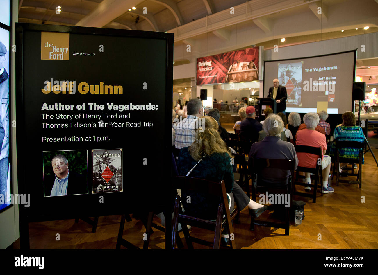 August 16, 2019, Detroit, Michigan, United States: Aug 16, 2019,  Dearborn, Michigan, United States;  Simon and Shuster author Jeff Guinn gives a program promoting his latest book :The Vagabonds'' who were the perod friends Thomas Edison, Henry Ford and Harvey Firestone who traveled together on road trips from 1914 to 1923. The Henry Ford Museum includes exhibits ranging from Transportation to History and Society and artifacts from the first Mustang Convertible to The bus that Rosa Parks rode to begin the civil rights movement to chair where President Lincoln was shot all located in Dearborn, Stock Photo