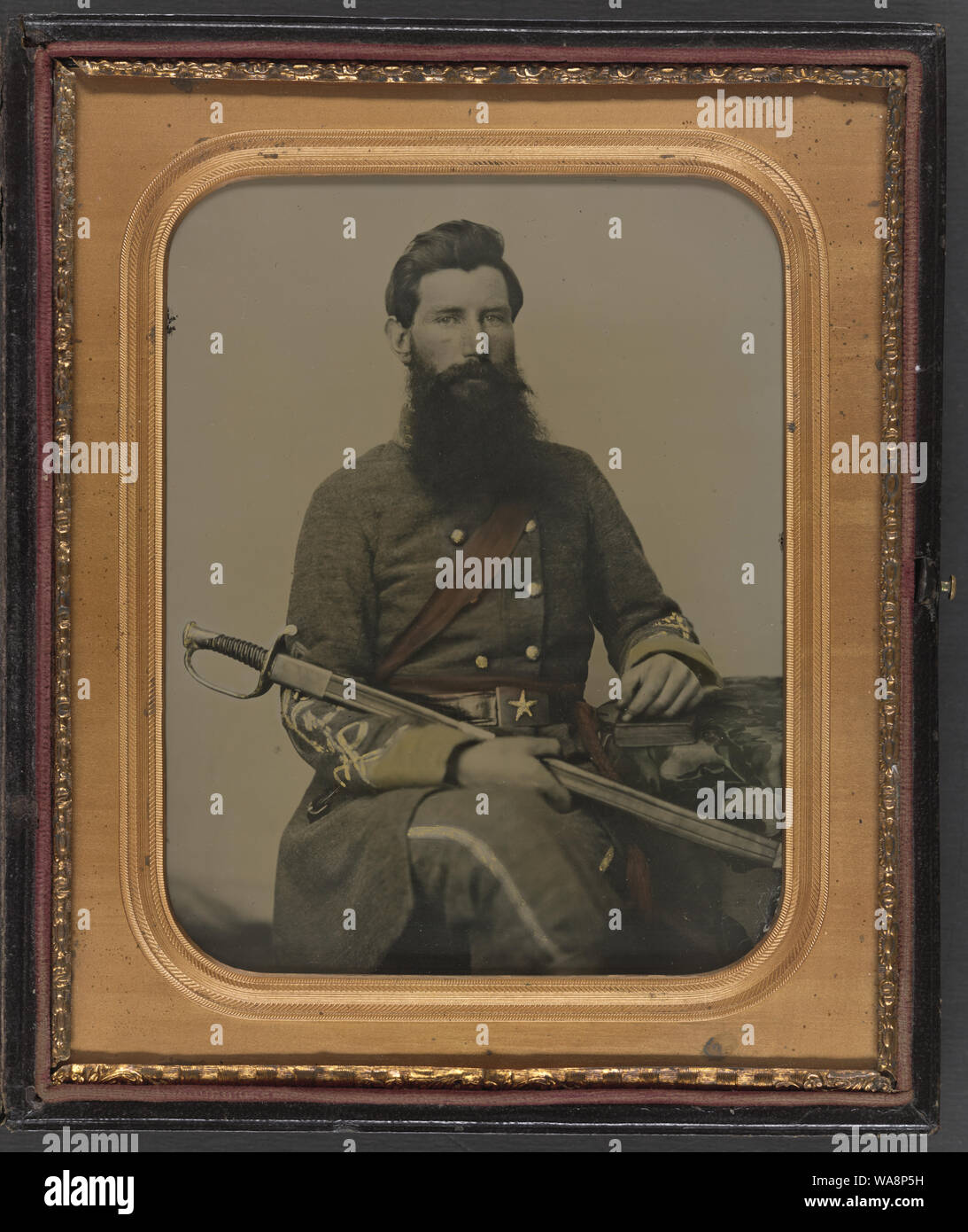 Captain George W. Hackworth of Co. F, 1st Virginia Cavalry Regiment, in uniform with sword Stock Photo