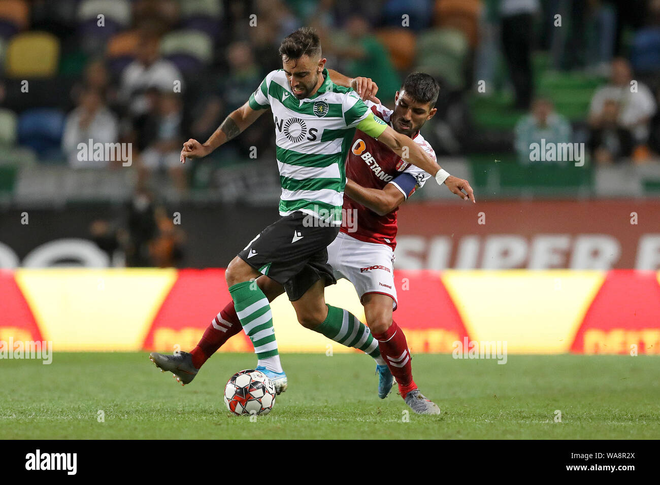 Bruno Fernandes of Sporting CP (L) and Ricardo Esgaio of SC Braga (R) are  seen in action during the League NOS 2019/20 football match between Sporting  CP and SC Braga in Lisbon.(Final