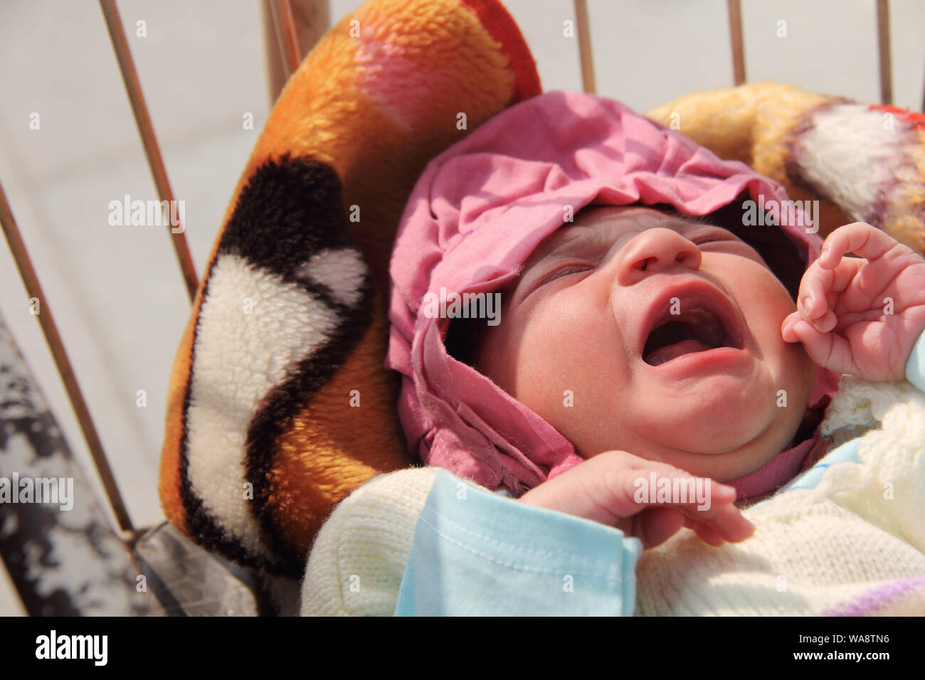 New Born baby crying Stock Photo