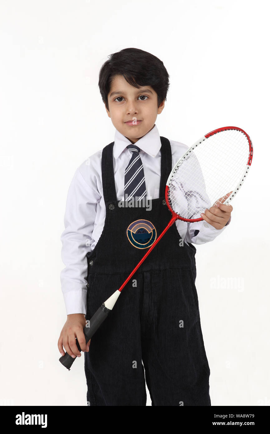 Schoolboy playing badminton Stock Photo