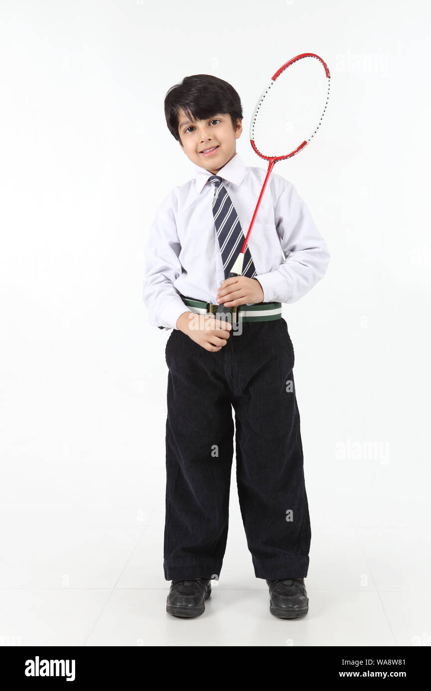 Schoolboy playing badminton Stock Photo