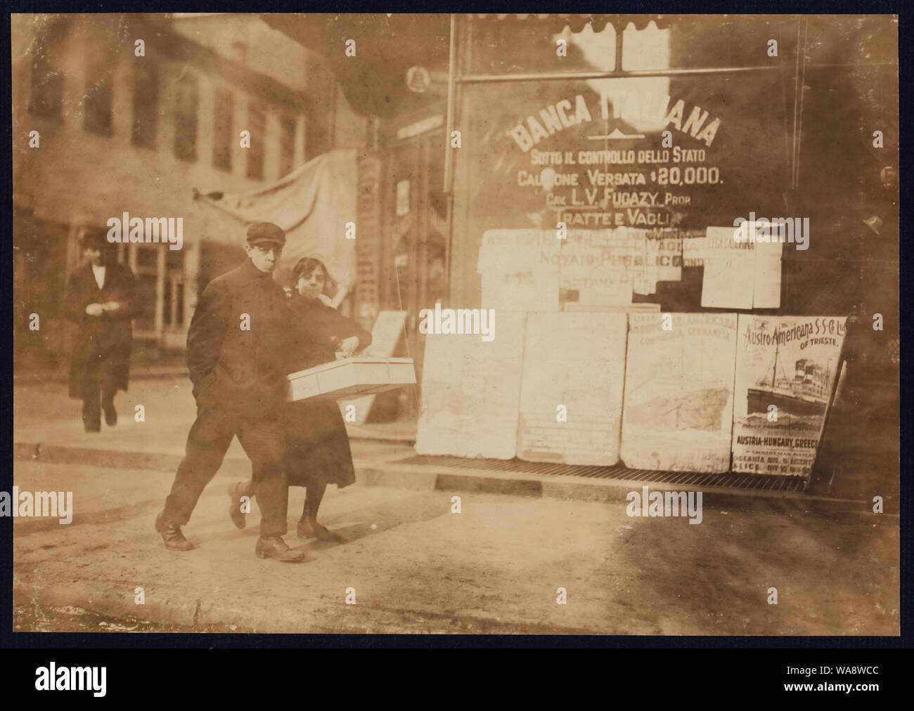 Carrying the flowers back to the factory. Bleeker St., N.Y. Abstract: Photographs from the records of the National Child Labor Committee (U.S.) Stock Photo