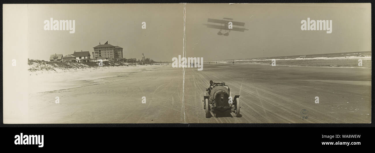 Cars on beach with airplane overhead and Clarendon Hotel in background ...