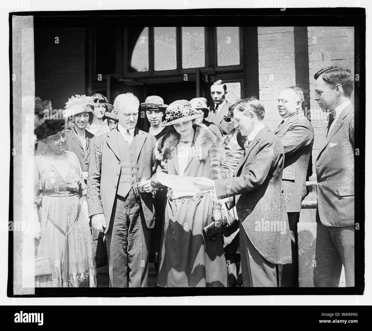 Catherine Butterfield with group of unidentified people,] 4/3/21 Stock