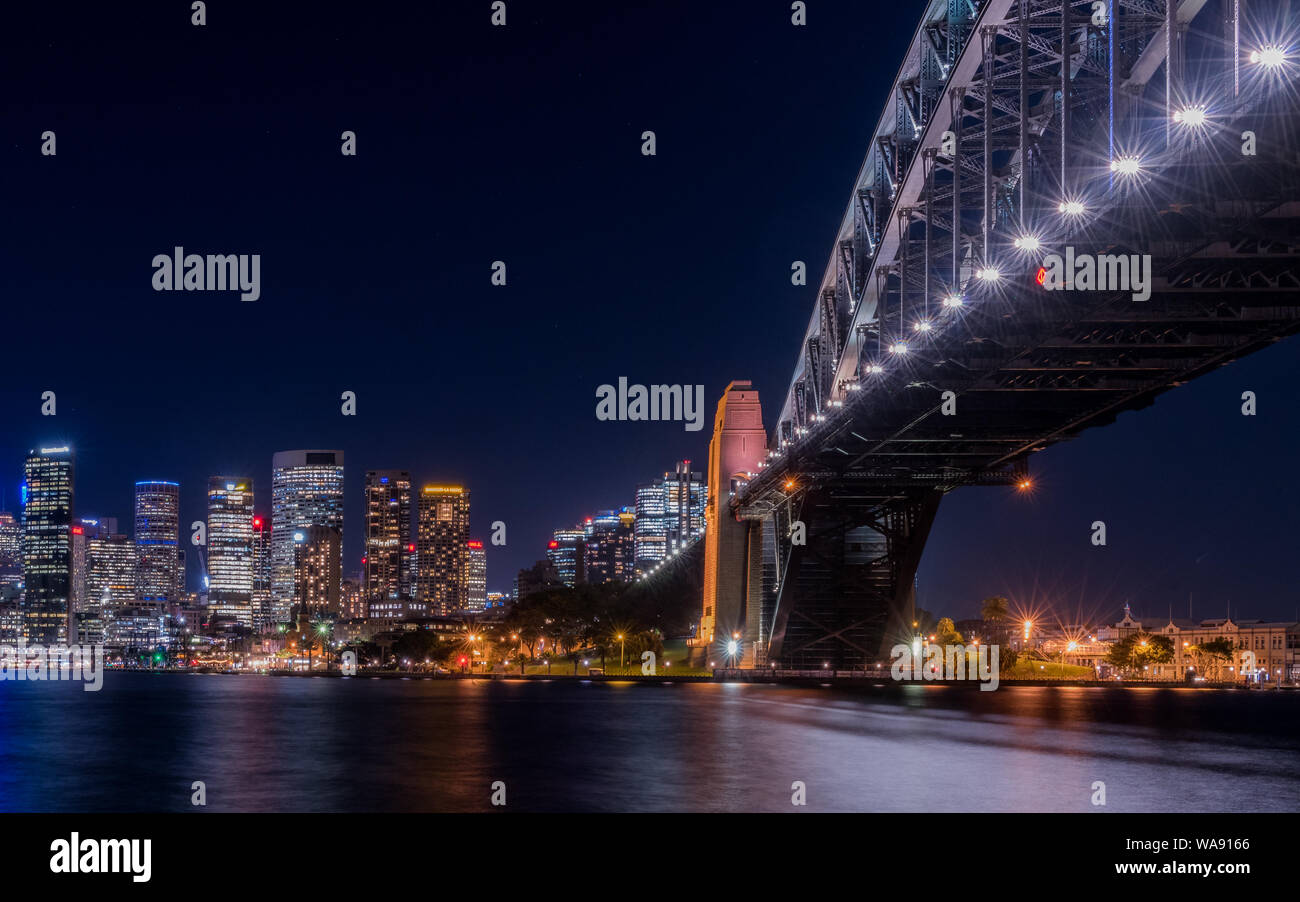 Sydney Skyline and view from under harbour bridge at night Stock Photo ...