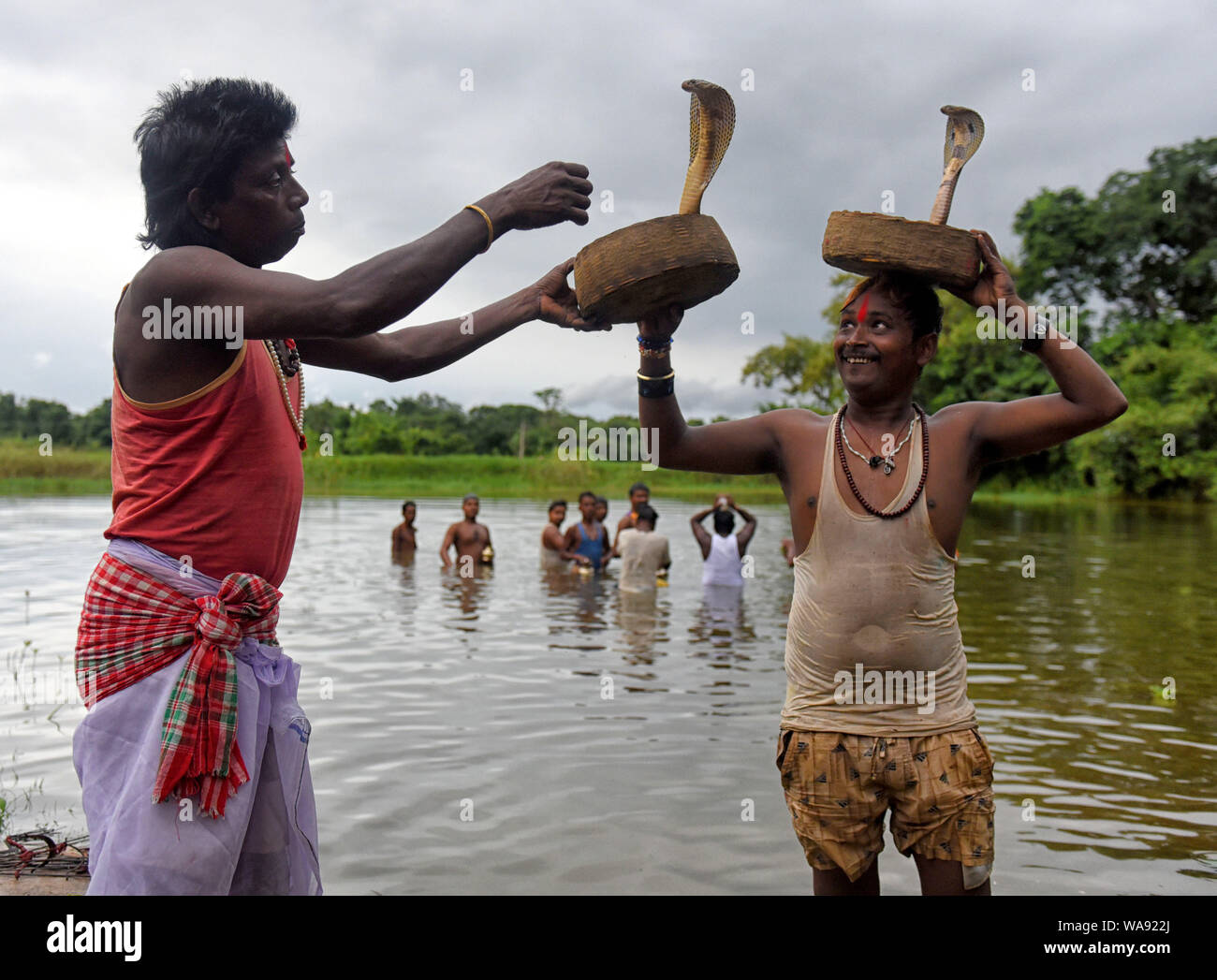 Snake Rituals Snake Charmers and local villagers seen showing different tricks with ...