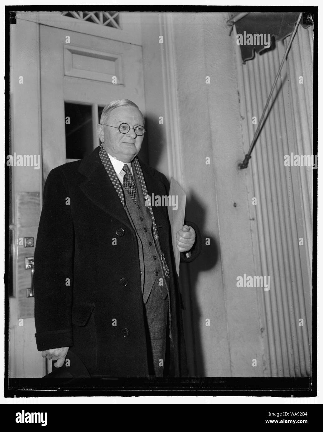 Census director confers with president. Washington, D.C., March 8. Leaving the White House today, William L. Austin, director of the census, refused to tell reporters what was discussed at a conference with President Roosevelt, 3-8-40 Stock Photo