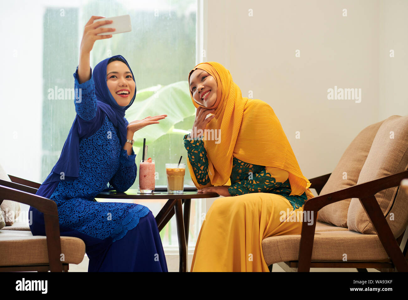 Two women in hijabs hi-res stock photography and images - Alamy