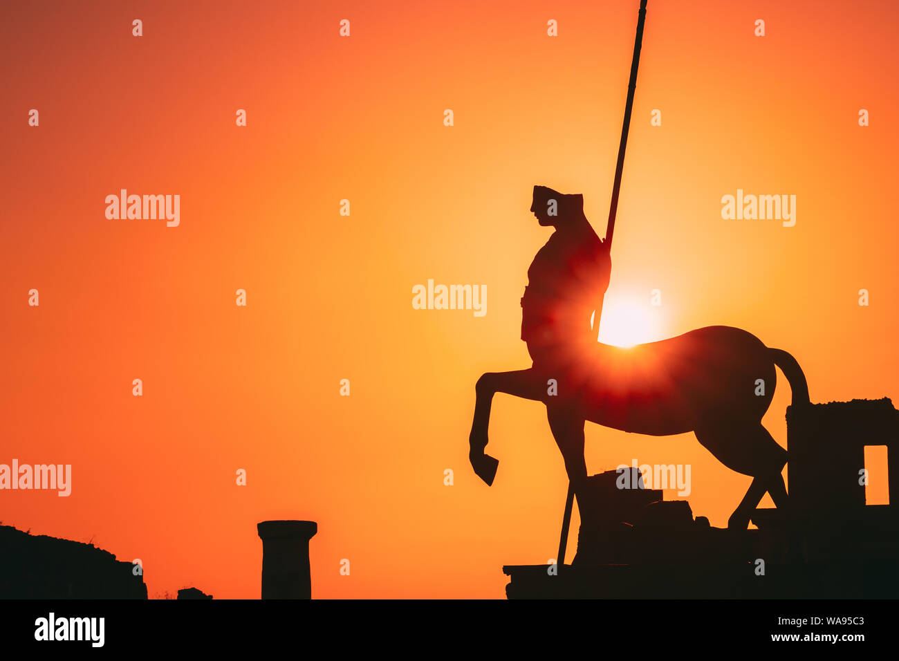 Pompeii, Italy. Statue Of Centaur On Territory Of Forum On Background Sunset Sunrise Sky. Stock Photo