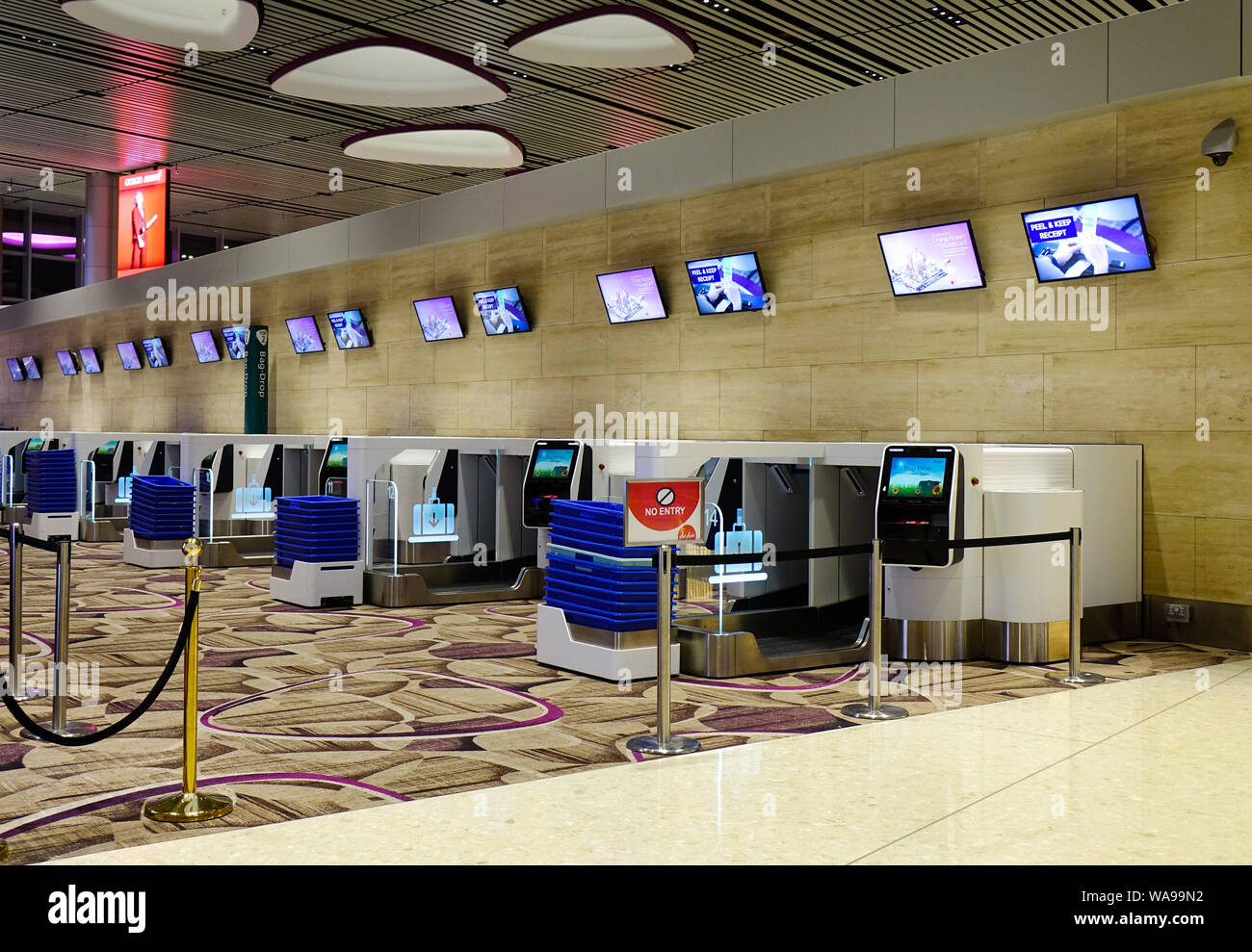 Singapore - Mar 28, 2019. Self-Service Check-in Kiosks at Terminal 4 of Changi Airport (SIN). Terminal 4 officially opened on October 2017. Stock Photo