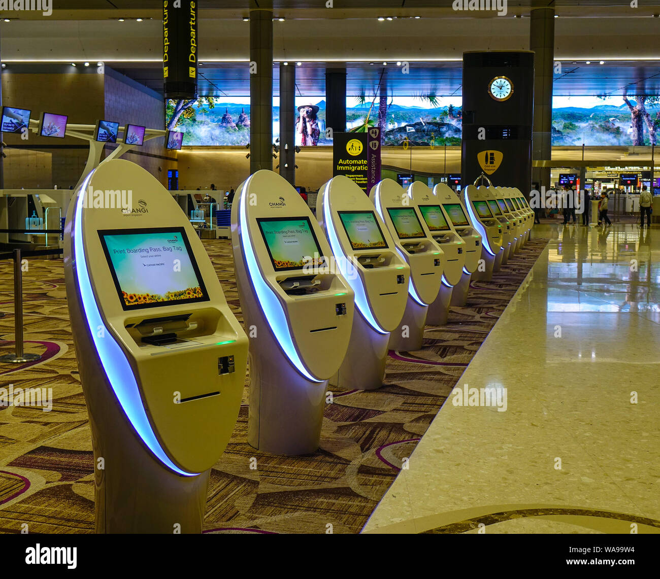 Singapore - Mar 28, 2019. Self-Service Check-in Kiosks at Terminal 4 of Changi Airport (SIN). Terminal 4 officially opened on October 2017. Stock Photo