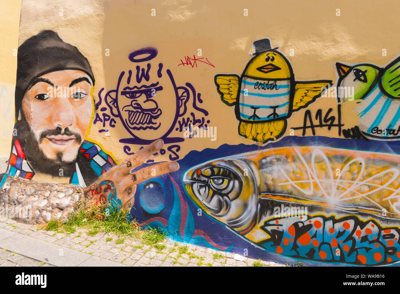 Portugal Oporto Porto graffiti wall mural picture street art Rua Sa Noronha  face bird birds APC WILL hand two fingers v sign steep hill road Stock  Photo - Alamy